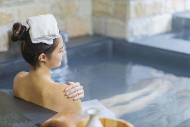 istock woman relax in hot spring 1428384106