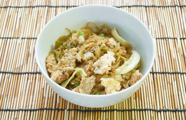 istock fried glass noodles slice pork and cabbage with egg 1428384120