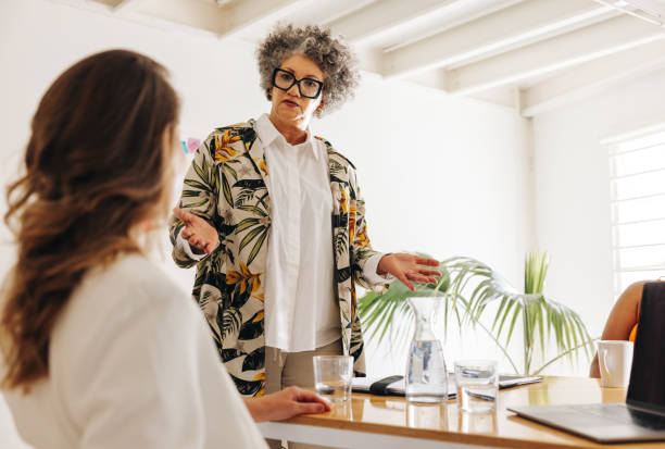 istock Mature team leader having a meeting with her colleagues 1428385895