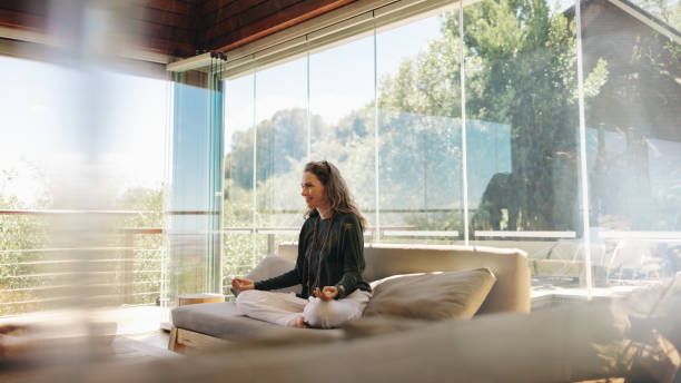 istock Holistic healer meditating on a couch 1428386069