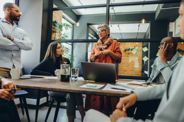 istock Creative entrepreneurs having a meeting in a modern workplace 1428387043