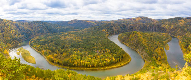 istock Autumn landscape with loop on Mana river in Siberia 1428387435