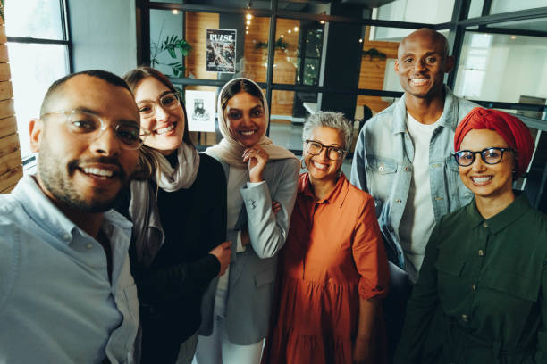 istock Happy business colleagues taking a selfie together 1428387597