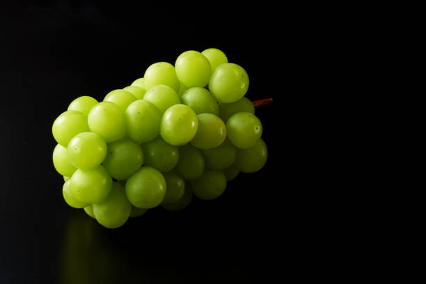 istock shine muscat fruits on black background 1428388742