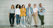 istock Diverse businesspeople standing together against a wall 1428392043