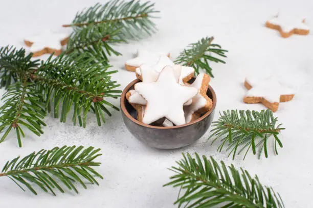 Cinnamon stars, traditional german christmas sweets, gingerbread coated with white sugar, winter season