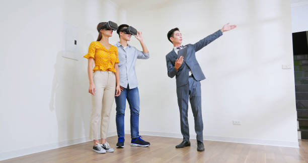istock couple wearing VR glasses 1428393104