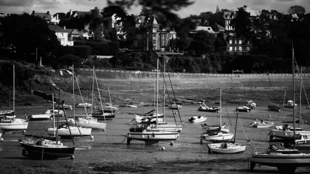 Boats laying on the sand during low tide