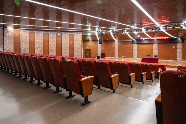 Free Stock Photo of Empty seats in a dimly lit conference hall ...