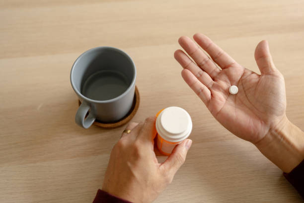 istock Senior Asian Man Reading Medicine Label 1428396415