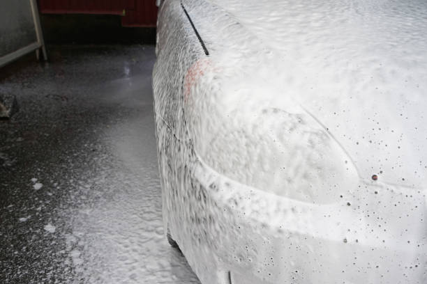 istock Cleaning automobile with foam, closeup. Car wash. 1428397303