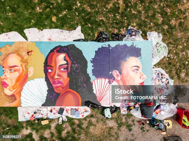 Drone View Of Young Latin Woman Creating Outdoor Mural Stock Photo - Download Image Now