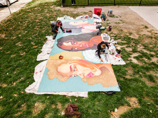 istock Two Young female artists creating outdoor mural 1428398417
