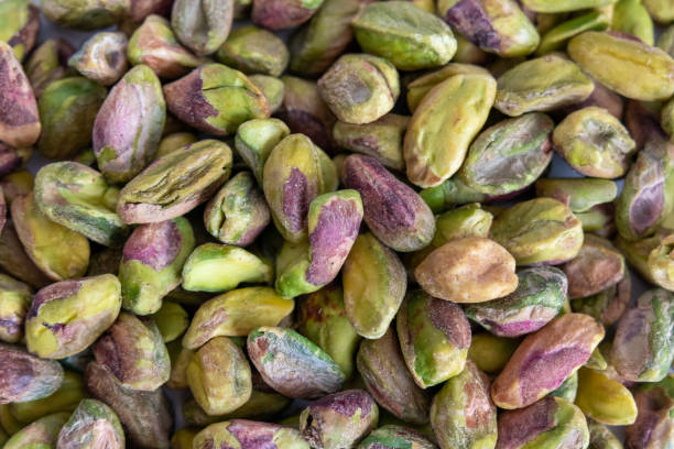 istock Lots of Peeled roasted pistachio nuts 1428405326