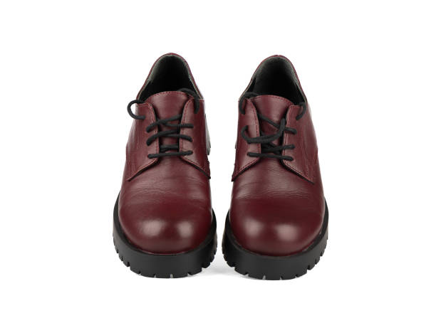 istock Brogues - women's boots with thick soles and laces on a white background. 1428405409