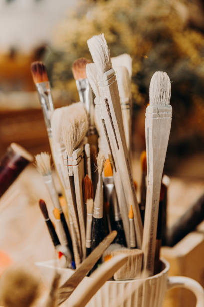 istock set of brushes of various sizes tucked into cup 1428407418