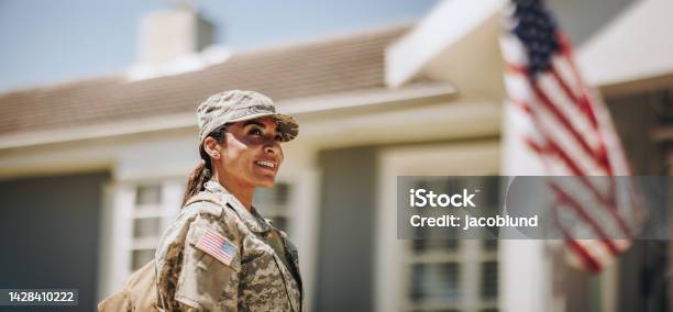 Happy Female Soldier Returning Home From The Military Stock Photo - Download Image Now