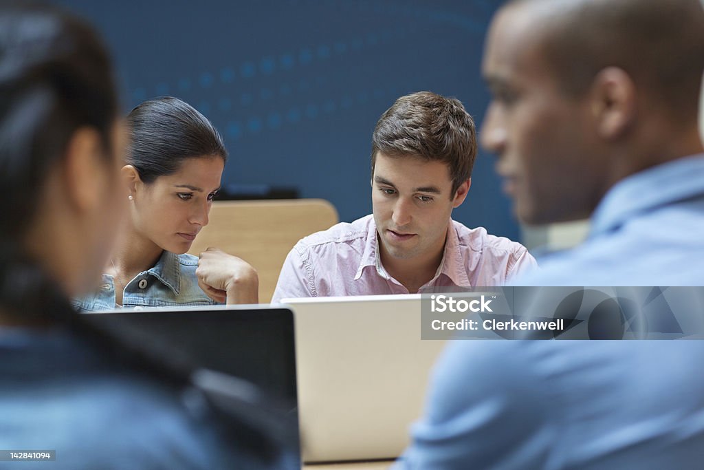 University students using laptop  University Student Stock Photo