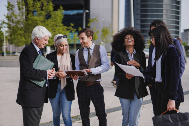 istock Multi generational business people working outside of office building 1428411696