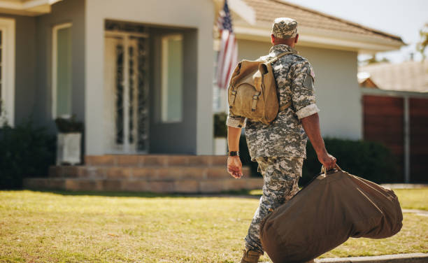istock Rearview of a patriotic soldier returning home 1428411949
