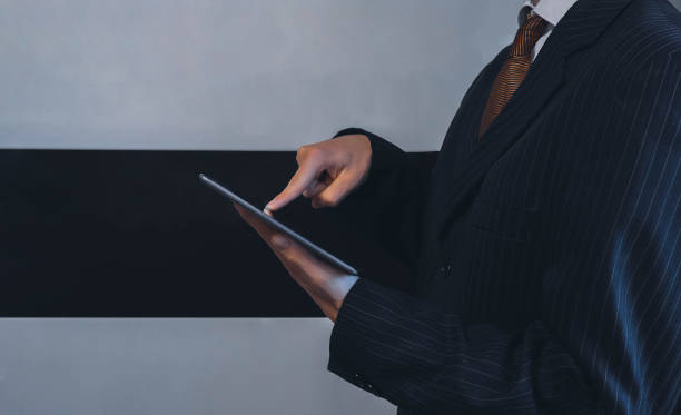 istock Manager pressing finger on tablet closeup concept image 1428412233