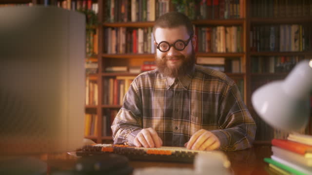 Portrait of funny-looking nerdy guy in eyeglasses in 90s office, retro lifestyle