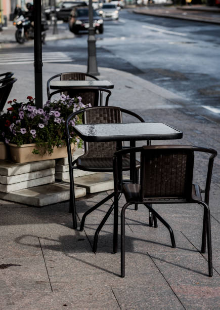 istock table and chairs at a sidewalk cafe. 1428412644