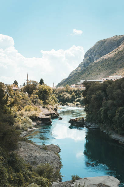 A view of the town of Mostar (Bosnia and Herzegovina) crossed by the Narenta river A view of the town of Mostar (Bosnia and Herzegovina) crossed by the Narenta river mostar stock pictures, royalty-free photos & images