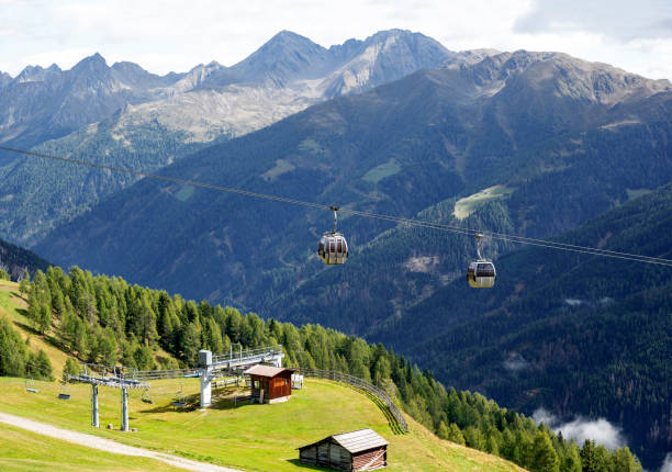 gondola cableway at the mountain Turnthaler with the mountain range Lienzer Dolomites in the background, Austria
