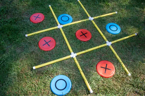 physical X's and O's of a grass lawn fun kids game