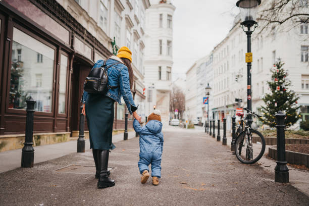 istock Mom and boy first steps in the city 1428420780