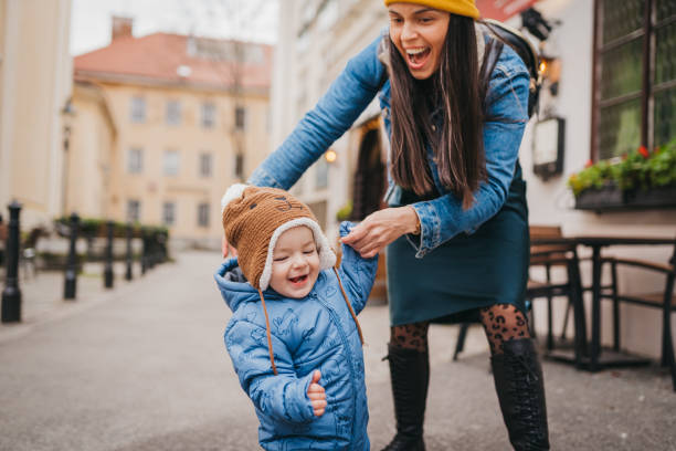 istock Mom and boy first steps in the city 1428420830
