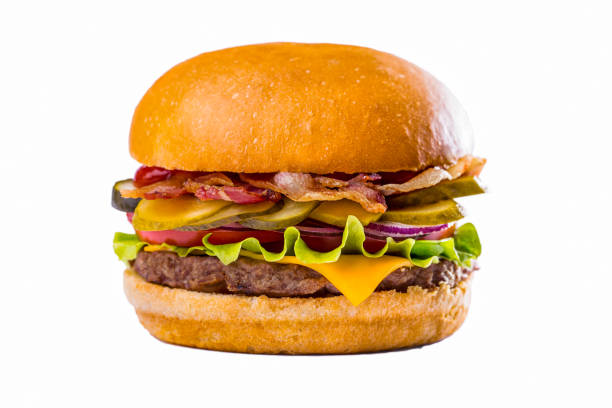 istock Burger with lettuce, meat cutlet, tomatoes, fried bacon, pickled cucumbers and cheese on a white background. Horizontal orientation 1428421117