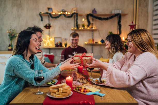 istock Friends exchanging Christmas presents 1428422845