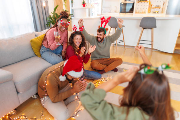 istock Friends playing charades while celebrating Christmas at home 1428423978