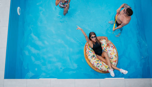 istock Friends are swimming in the pool 1428425287