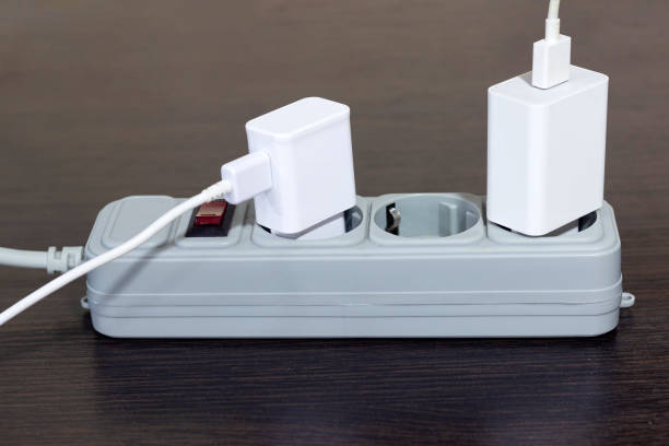 istock electrical socket, extension cord with electrical appliances turned on, the concept of saving electricity and turning off electrical appliances 1428426618