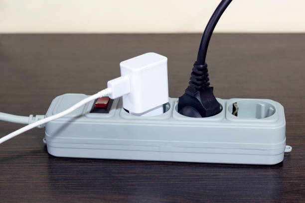 istock electrical socket, extension cord with electrical appliances turned on, the concept of saving electricity and turning off electrical appliances 1428426619