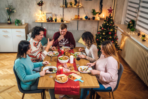 istock Friends having Christmas dinner 1428428234