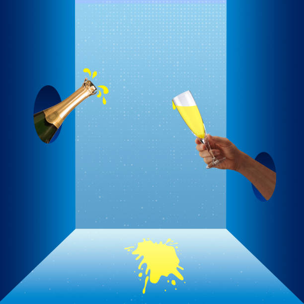 istock The hand holds a glass, an open bottle with splashes. 1428430197