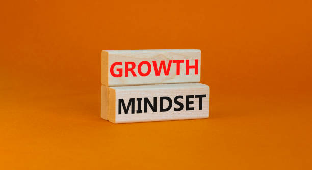 istock Growth mindset symbol. Wooden blocks with concept words Growth mindset on beautiful orange background. Business growth mindset concept. Copy space. 1428430954