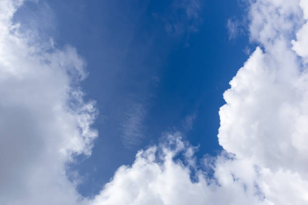 istock Patch of blue sky among white clouds 1428433464