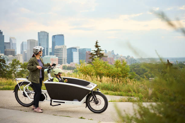 Mom and son looking at the view while riding a cargo bike