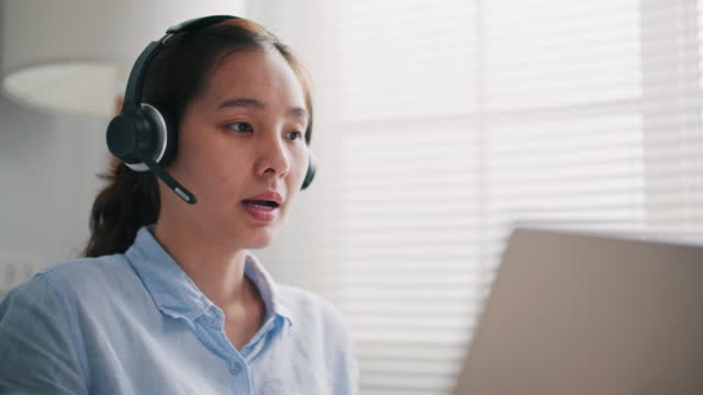 Asian Call center Support her Customer at home