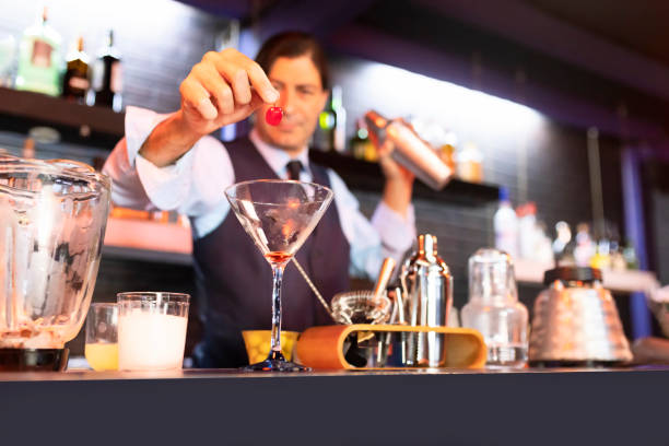 Latin bartender preparing a daiquiri stock photo
