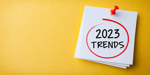 istock Trends 2023 Word in White Sticky Note on Yellow Cardboard Background 1428445406