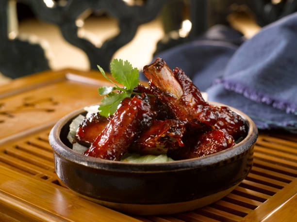 istock Earthen Bowl Ribs served in a pot isolated on table side view 1428446983