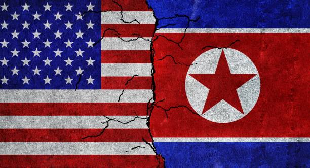 istock Flags of USA and North Korea. Conflicts between North Korea and USA 1428447211