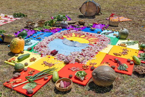 Spiritual ceremony Chakana  or Andean cross Andean cross, Chakana or Ceremony in homage to Pachamama (Mother Earth) - is an aboriginal ritual of the indigenous peoples of the central Andes. Cross made from plants, food, seeds. Ecuador, Cuenca inti raymi stock pictures, royalty-free photos & images