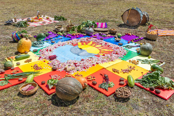 Spiritual ceremony Chakana  or Andean cross Andean cross, Chakana or Ceremony in homage to Pachamama (Mother Earth) - is an aboriginal ritual of the indigenous peoples of the central Andes. Cross made from plants, food, seeds. Ecuador, Cuenca inti raymi stock pictures, royalty-free photos & images